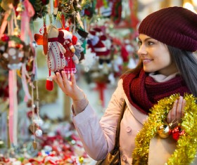 Woman buying christmas decoration Stock Photo