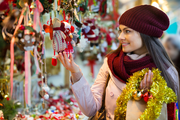 Woman buying christmas decoration Stock Photo