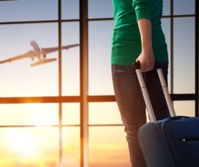 Woman holding a travel bag Stock Photo
