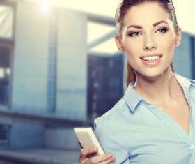 Woman holding cellphone Stock Photo