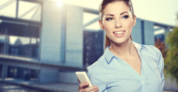 Woman holding cellphone Stock Photo