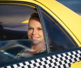 Woman sitting in a taxi car Stock Photo