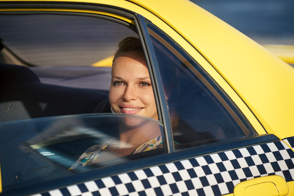 Woman sitting in a taxi car Stock Photo