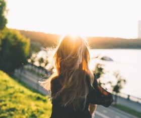 Woman sitting on the hillside Stock Photo