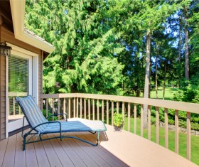 Wooden balcony with lounge chairs Stock Photo