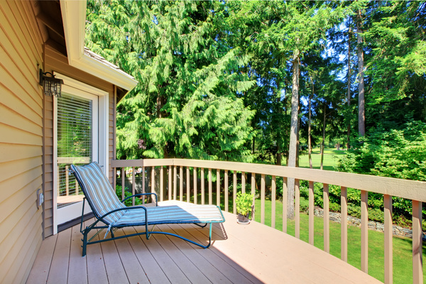 Wooden balcony with lounge chairs Stock Photo