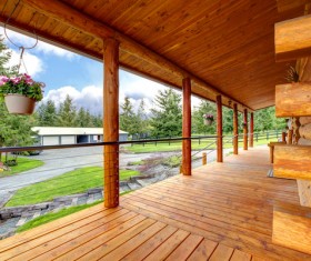 Wooden house with flower basket under the eaves Stock Photo