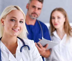 Young female doctor posing with colleague Stock Photo