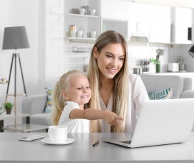 Young mother with daughter at home Stock Photo 01