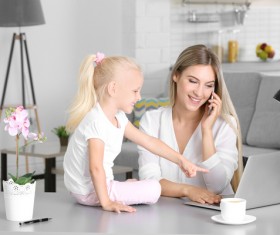Young mother with daughter at home Stock Photo 03