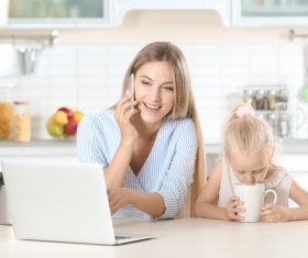 Young mothers calling in the kitchen Stock Photo 04