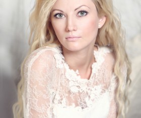 blonde woman wearing white dress Stock Photo