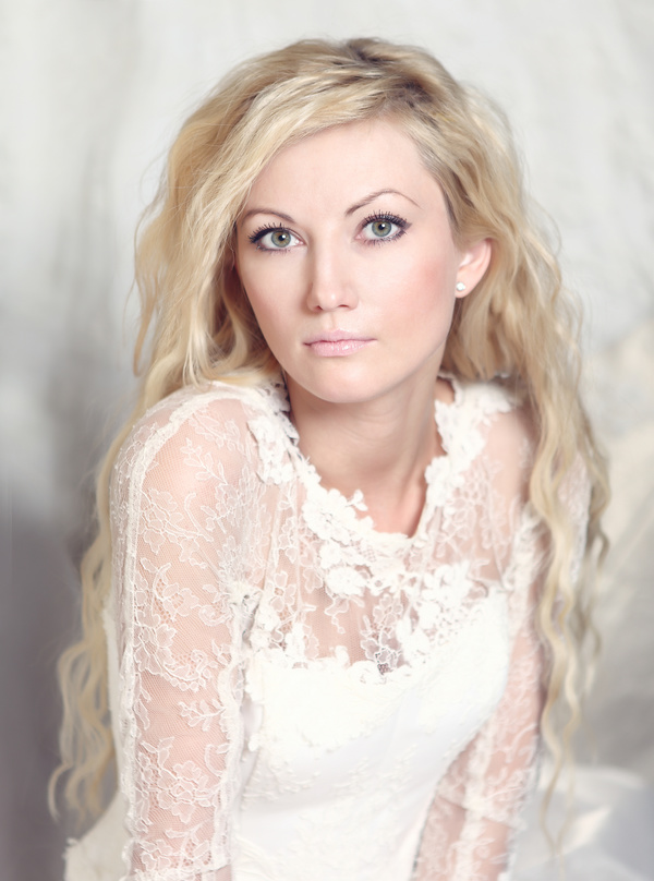 blonde woman wearing white dress Stock Photo