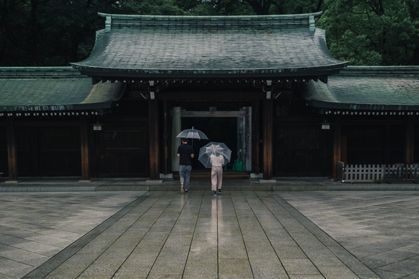couple walking asia ancient temple under rain Stock Photo
