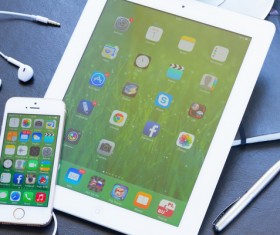 iPhone and Tablet Social Media Applications Stock Photo