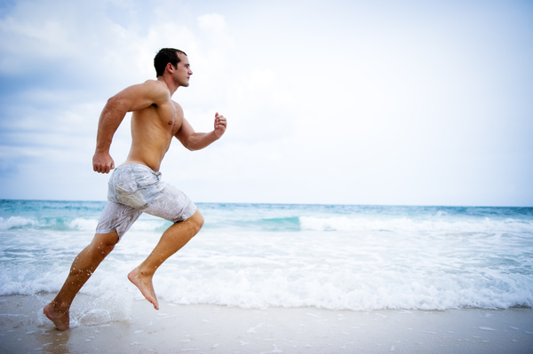 man running on the beach Stock Photo 02