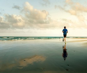 man running on the beach Stock Photo 03