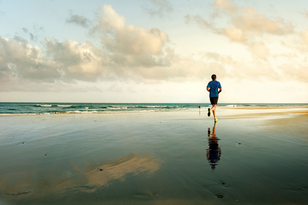 man running on the beach Stock Photo 03