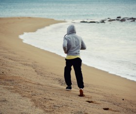 man running on the beach Stock Photo 04