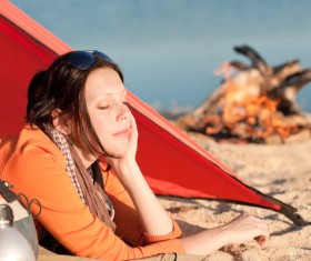 woman resting in a tent Stock Photo