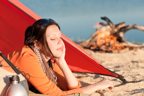 woman resting in a tent Stock Photo