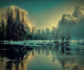 Alpine trees reflection in the lake Stock Photo