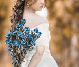 Asia girl hold wildflowers Stock Photo 02