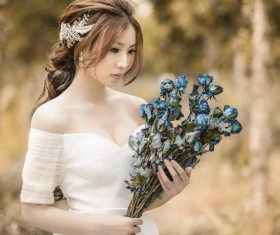 Asia girl hold wildflowers Stock Photo 03