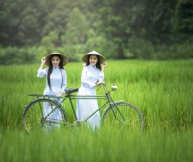 Beautiful Vietnamese girl standing in farmland Stock Photo