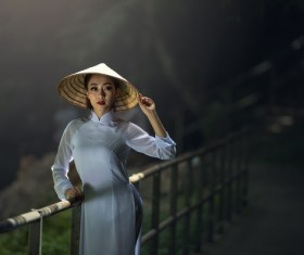 Beautiful Vietnamese girl wearing straw hat Stock Photo