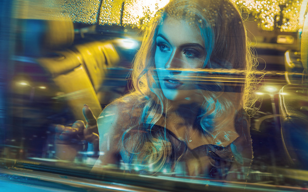 Beautiful blonde sitting in limousine Stock Photo