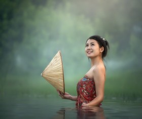 Beautiful girl standing in stream Stock Photo
