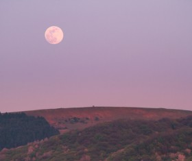 Beautiful moon scene on hill Stock Photo