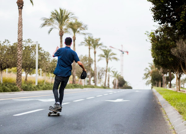 Boy on skateboard highway Stock Photo