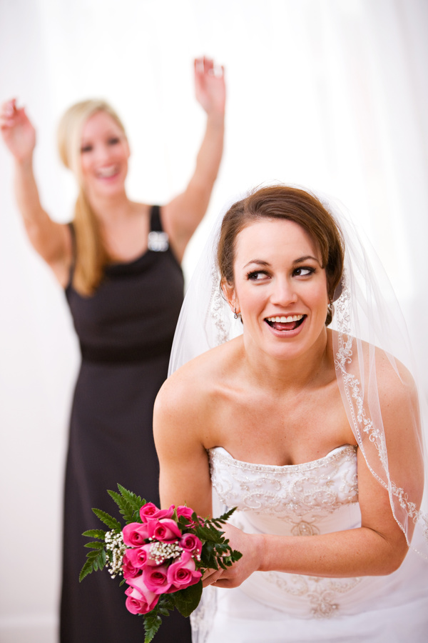 Bride throwing bouquet Stock Photo