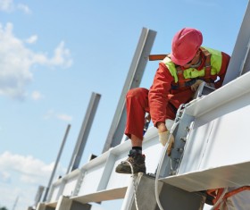Bridge construction workers Stock Photo