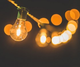 Bright lightbulb in darkness Stock Photo