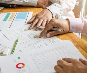 Business people who analyze market data with colleagues Stock Photo 01