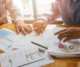 Business people who analyze market data with colleagues Stock Photo 02