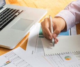 Businessman calculating market data Stock Photo 04