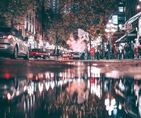 Bustling city lights at night Stock Photo