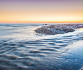 Calm beach at low tide Stock Photo