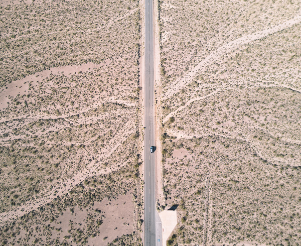 Cars driving on the desert highway Stock Photo