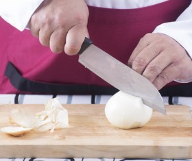 Chef cuts the onion Stock Photo