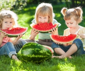 Children eating watermelon in summer Stock Photo