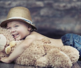 Children holding teddy bear Stock Photo