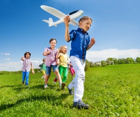 Children playing together on the grass Stock Photo 01