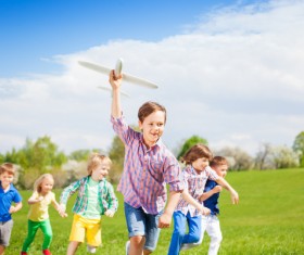 Children playing together on the grass Stock Photo 02