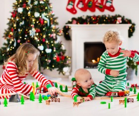 Children playing toy train together Stock Photo 02