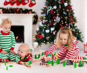 Children playing toy train together Stock Photo 03